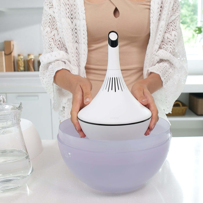 woman putting together the Miro NR08M Humidifier